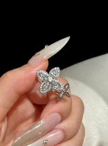 Close-up of elegant zirconia star flower open ring featuring sparkling marquise stones.