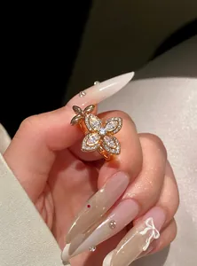 Close-up detail of a sparkling zircon flower ring with an elegant open-band design