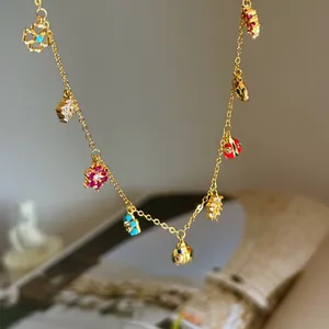 Gold chain necklace with colorful diamond flower and ladybug charms, sweet vacation style