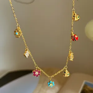 Sweet flower and ladybug pendant gold necklace for women, cute vacation style choker jewelry.