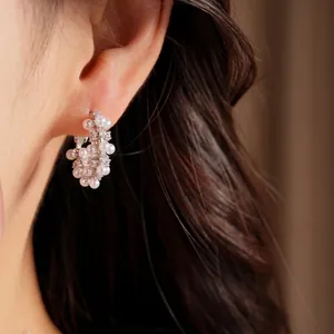 Elegant silver hoop earrings with delicate pearls and sparkling zirconia stones