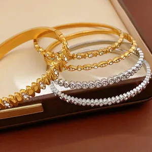 Elegant stainless steel bangles with heart pattern and zircon inlay in gold and silver