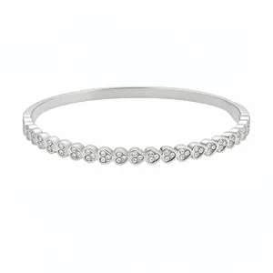 Elegant silver-tone stainless steel heart bangle with pavé cubic zirconia stones