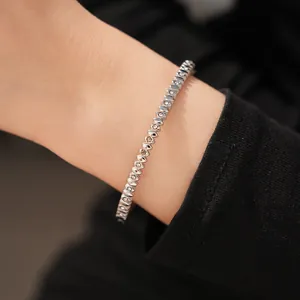 Close-up view of elegant silver stainless steel bracelet set with sparkling zircons