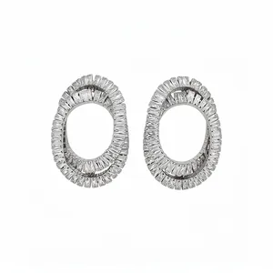 Elegant silver oval twisted hoop earrings densely set with baguette cubic zirconia stones