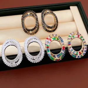 Detailed view of oval zircon cross stud earrings in black, white, and multi-color options.