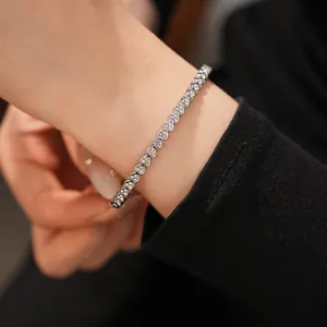Detailed view of stainless steel heart-shaped bracelet with shimmering zircon stones