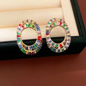 Detailed close-up of luxury oval stud earrings inlaid with vibrant multi-color zircon stones
