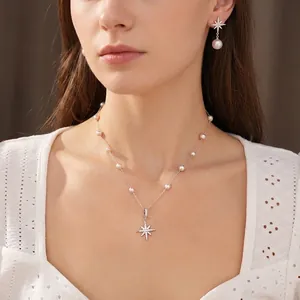 Elegant silver starburst and pearl necklace set with zircon accents for stylish women.