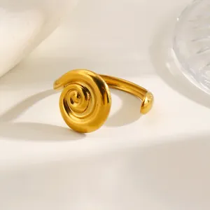Elegant gold-tone stainless steel open ring featuring a minimalist swirl design