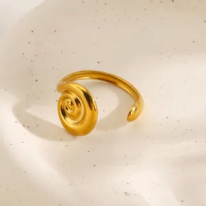 Modern gold stainless steel spiral swirl open ring with a minimalist polished finish