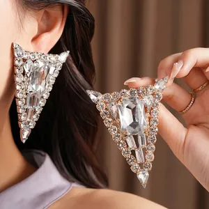 Exaggerated silver needle triangular stud earrings with sparkling clear crystals