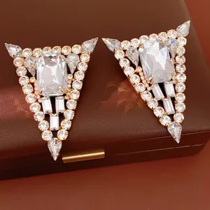Luxurious oversized triangle rhinestone stud earrings featuring geometric crystal drops