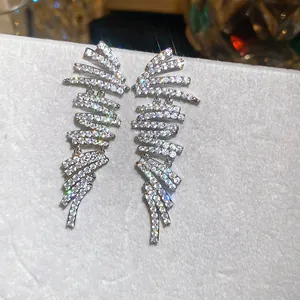 Close-up of luxury 18k gold plated geometric earrings with sparkling cubic zirconia stones