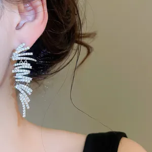 Detailed close-up view of silver 18k plated geometric earrings with sparkly zircons