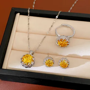 Detailed shot of elegant yellow zircon necklace ring and earrings set in display box