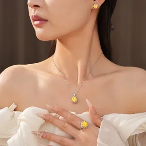 Elegant yellow zircon jewelry set including necklace, earrings and ring on model