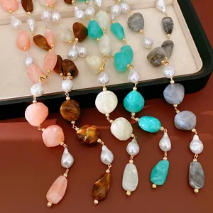 Close-up of irregular geometric acrylic and pearl necklaces in vibrant various colors