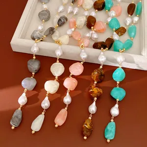 Detailed view of colorful irregular acrylic stones and water-drop pearl necklace