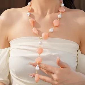 Model wearing irregular pink and white acrylic pearl necklace for trendy fashion look