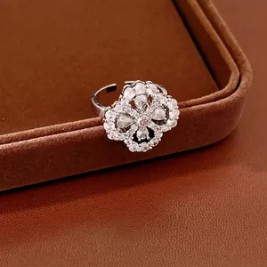 Elegant zircon flower open ring with drop-shaped petals and sparkling hollow design.