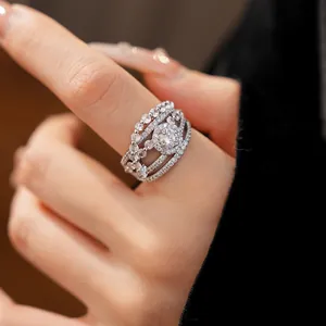 Close-up of a luxurious silver multi-layer hollow ring with sparkling zirconia