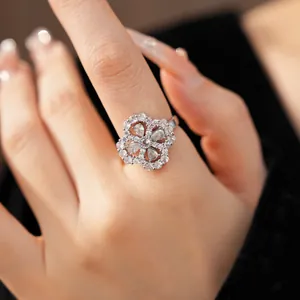 Macro detail of elegant silver flower zircon ring with teardrop hollow design on model