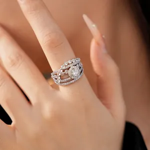 Detailed close-up of a luxury zircon studded flower teardrop hollow out open ring