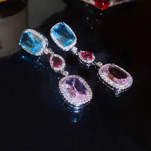 Elegant silver drop earrings featuring multi-colored teardrop and oval cubic zirconia