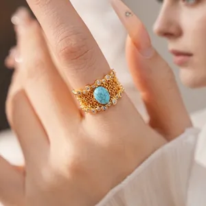 Vintage gold-plated hollow floral ring with turquoise and sparkling zircon accents