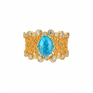 Vintage gold-plated hollow floral ring featuring oval turquoise and clear zircons