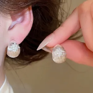 Elegant 18k gold plated silver stud earrings with zircon flower detail for women
