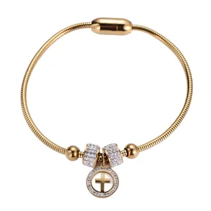 Gold snake chain bracelet with sparkling crystal cross pendant and magnetic clasp