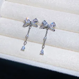 Elegante Schleifen-Ohrringe im koreanischen Stil mit Zirkonia und Perlen-Quasten.
