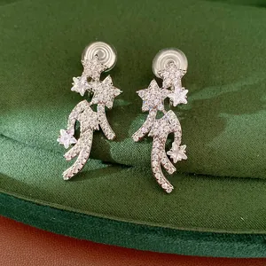 Close-up of elegant star-shaped clip-on earrings paved with sparkling cubic zirconia