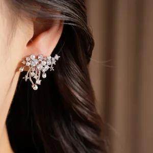 Exquisite silver ear cuff featuring shimmering zircons and elegant pearls with star details