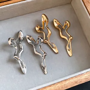 Unique irregular hollow silver needle earrings with abstract liquid metal design.