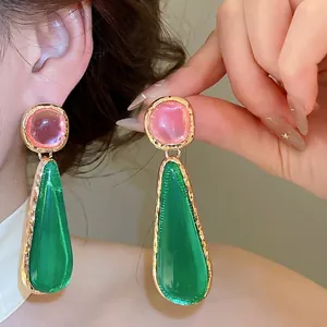 Vintage geometric drop earrings with green and pink resin stones in a luxury gold finish