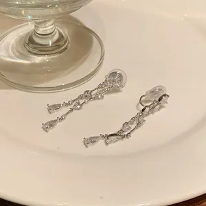 Elegant silver-tone heart and waterdrop tassel clip-on earrings with sparkly zircons stones