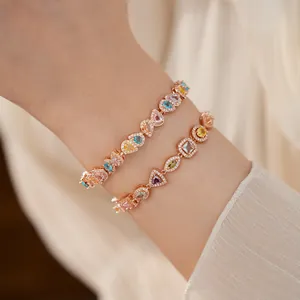 Detailed view of elegant 18k rose gold plated bracelets with colorful geometric zircons