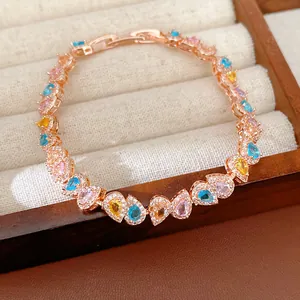 Detailed close-up of a premium rose gold bracelet with heart-shaped colorful zircons
