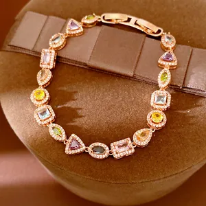 Close-up of 18k gold plated bracelet with multi-colored geometric cubic zirconia stones