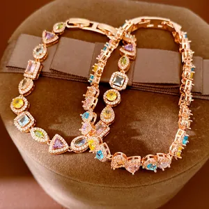 Close-up detail of 18k rose gold plated bracelet with multi-color geometric zircons