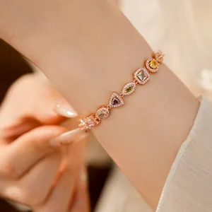 Detailed view of 18k gold plated geometric bracelet with multi-colored zircons