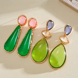 Exquisite detail of colorful resin drop earrings with vintage gold-toned settings