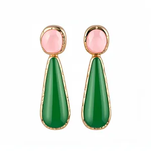 Elegant pink and green resin teardrop earrings with gold-toned textured metal frame.