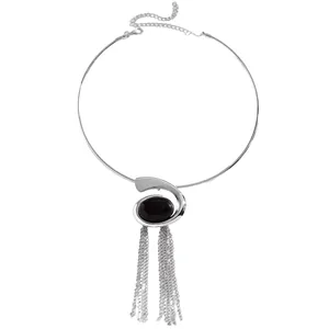 Detailed view of a silver snail-shaped choker with black stone and hanging tassels.