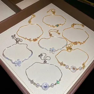 Eleganti braccialetti di fiori in zircone con motivi a stella in finiture oro e argento