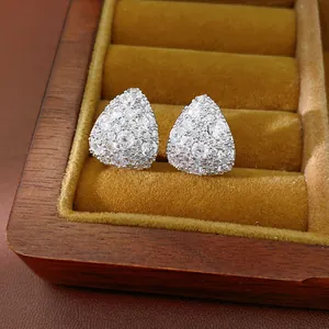 Close-up of teardrop cubic zirconia stud earrings in a velvet jewelry box