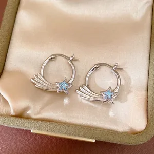 Minimalist silver-colored hoop earrings with blue zircon star and shooting star design